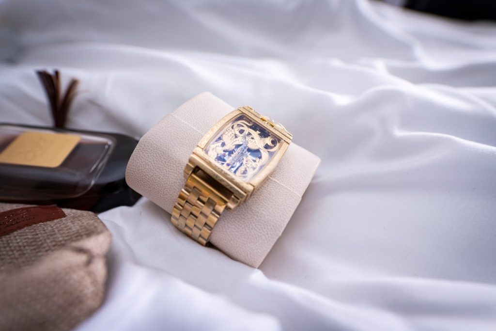 a gold ring on a white cloth