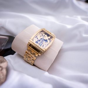 a gold ring on a white cloth