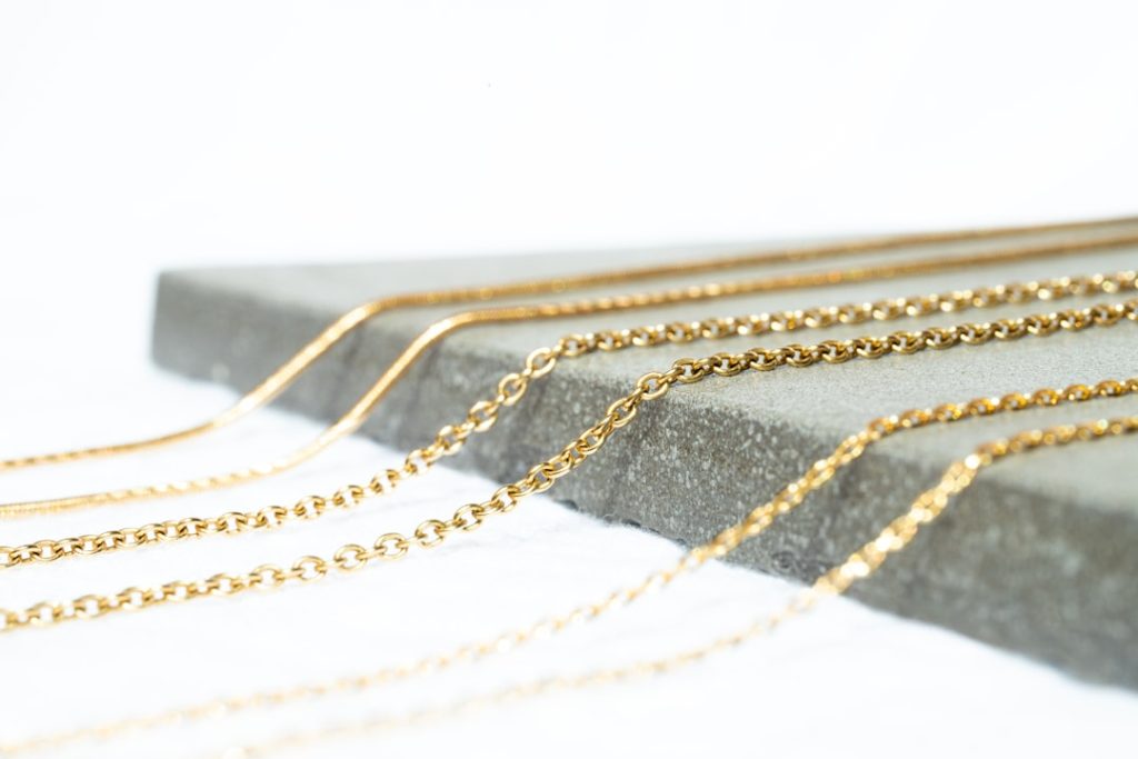 a gold chain with a black band