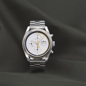 a watch sitting on top of a black cloth