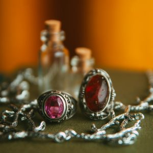 a close up of a pair of earrings on a table