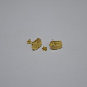 Two pairs of gold earrings on white background