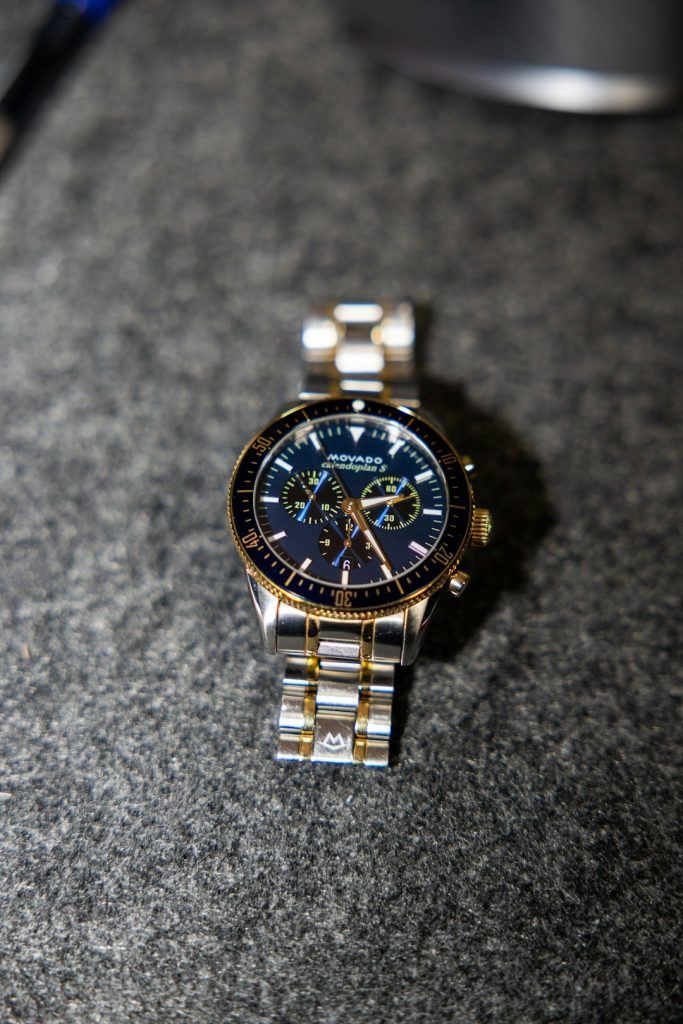 A close-up of a gold and silver watch