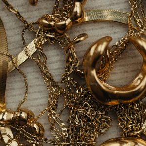 a close up of a bunch of gold jewelry